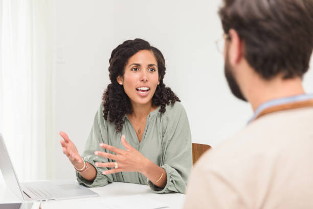 istock Female employee makes presentation to unrecognizable male boss 1279187408
