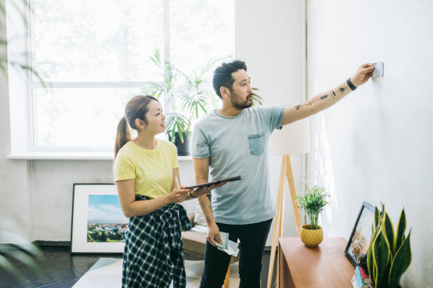 istock Couple choosing the right color for their walls 1279187780