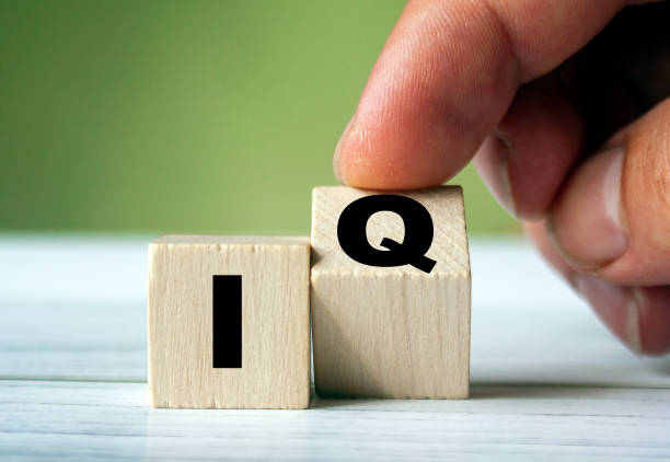 istock IQ word concept on wooden cube.  Intelligence symbol. Brain or talent background idea 1279189349