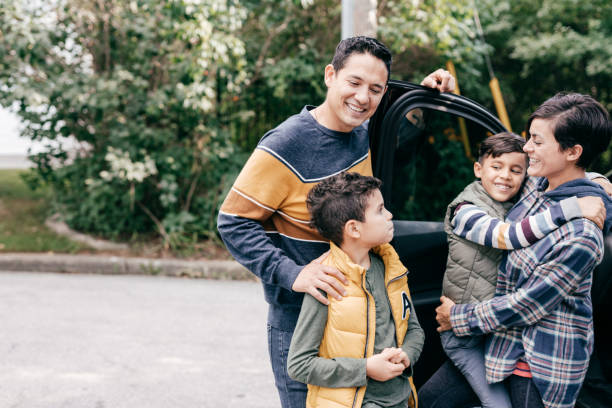 istock Hispanic family with 2 kids getting ready for road trip 1279190212