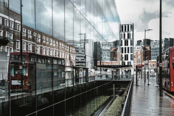 istock Bus reflected in the glass facade 1279191705