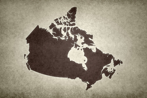 Grunge map of Canada printed within on an old paper.