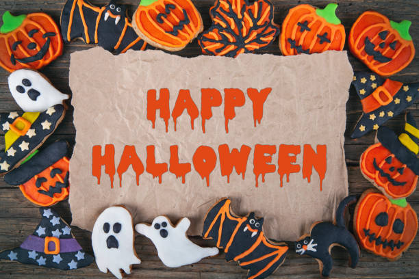 istock Fresh Halloween gingerbread cookies on brown wooden table 1279195900