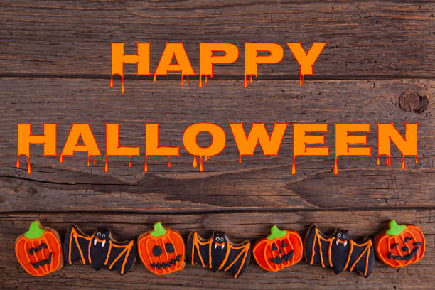 istock Halloween gingerbread cookies on rustic wooden table 1279195917