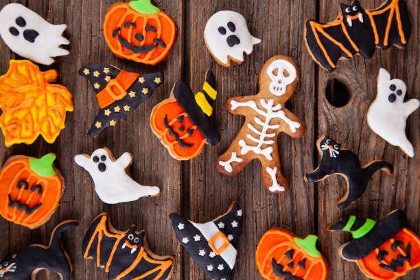 istock Halloween homemade gingerbread cookies on rustic wooden table 1279195973