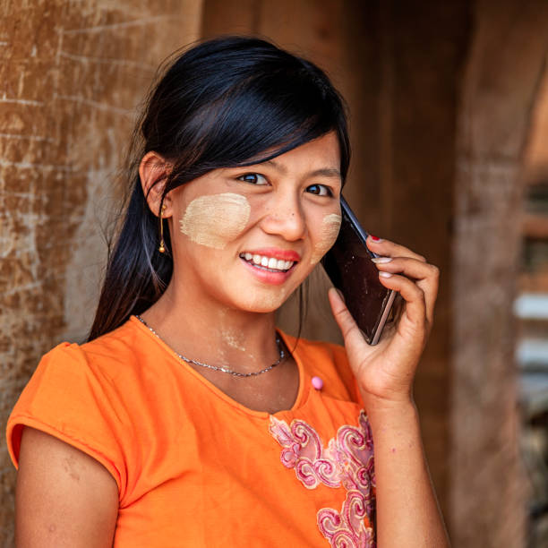istock Young Burmese girl using mobile in Bagan, Myanmar 1279195976