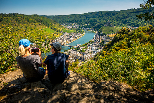 mother and son taking pictures from Cochem and River Mosel in Germany
