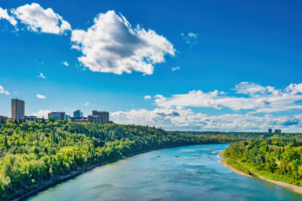 North Saskatchewan River in Edmonton Alberta Canada University of Alberta Stock photograph of the North Saskatchewan River and University of Alberta campus in Edmonton Alberta Canada on a sunny day. edmonton river valley stock pictures, royalty-free photos & images