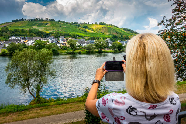 woman taking pictures at Mosel River in Germany