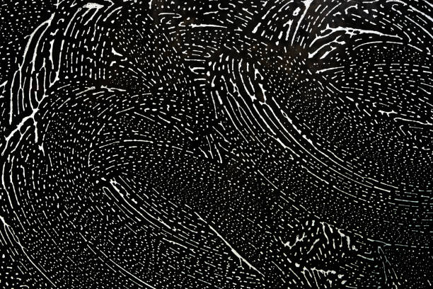Abstract background, glass covered with foam with stains from a rag