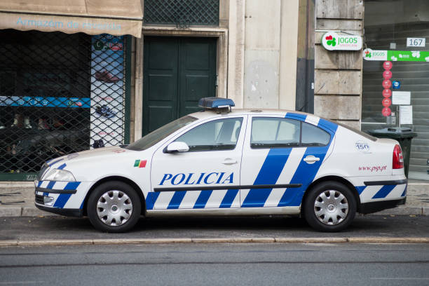 Profil view of partuguese police car parked in the street Lisbon - Portugal - 30 September 2020 - Profil view of partuguese police car parked in the street psp stock pictures, royalty-free photos & images