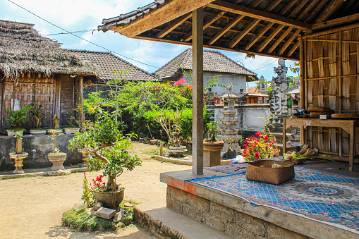 In September 2015, local inhabitants are welcoming tourists to visit their typical house in Ubud, Bali, Indonesia.