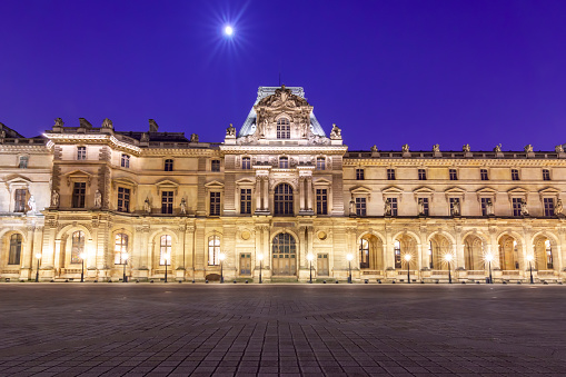 Paris, France - May 2019: Louvre palace at night