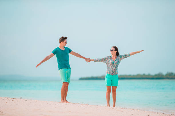 istock Young couple on white beach during summer vacation. 1279202314