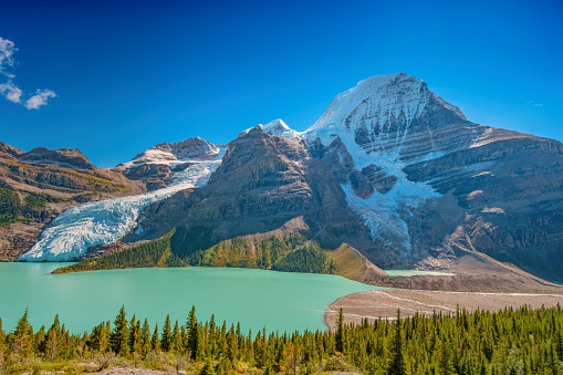 Mount Robson and Berg Lake in Mount Robson Provincial Park, BC, Canada on a sunny day.
