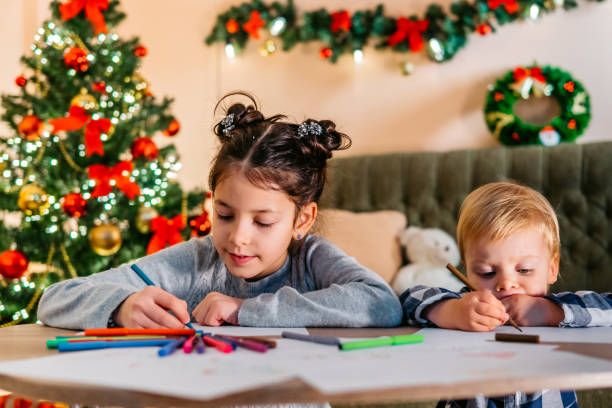 Kids playing and drawing at Christmas