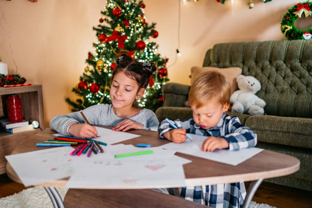 istock Kids playing and drawing at Christmas 1279203681