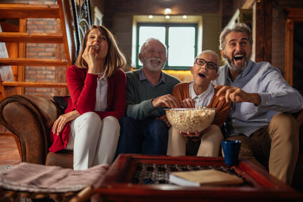 istock Watching tv with friends 1279204396