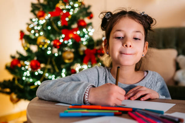 istock Cute girl drawing at Christmas 1279204585