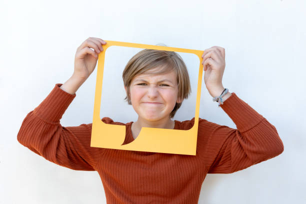 istock Unhappy Caucasian Tween Girl Showing Negative Feedback in Yellow Speech Text Bubble 1279205565