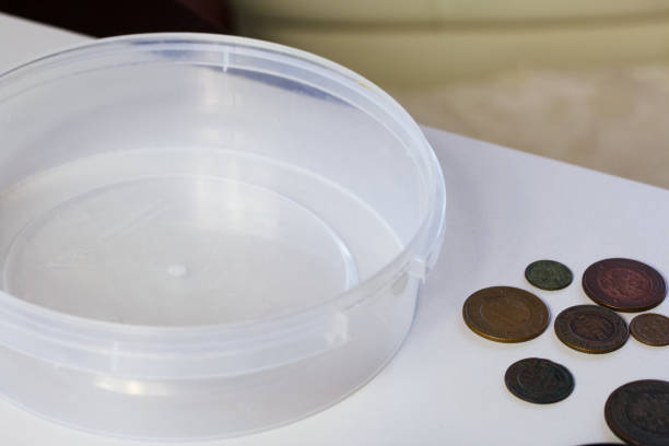 Corroded copper coins. Lay on the table surface before cleaning and patinating.