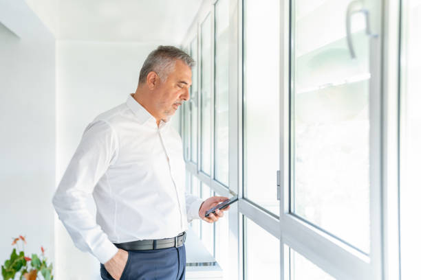 istock Businessman in office talking on phone 1279208118