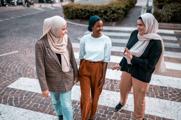 istock Three women walking crossing street 1279210862