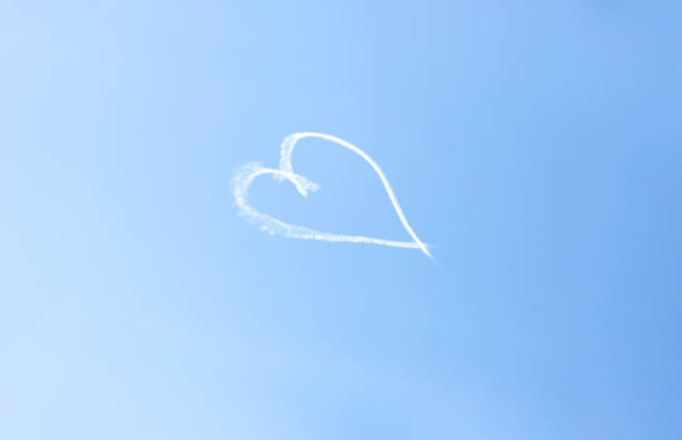 istock Heart in the sky, light blue background with copy space 1279212161
