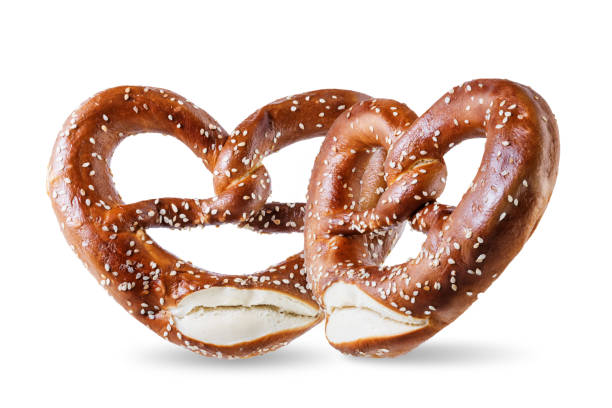 istock Pretzel with salt and sesame seeds on a white isolated background 1279212549