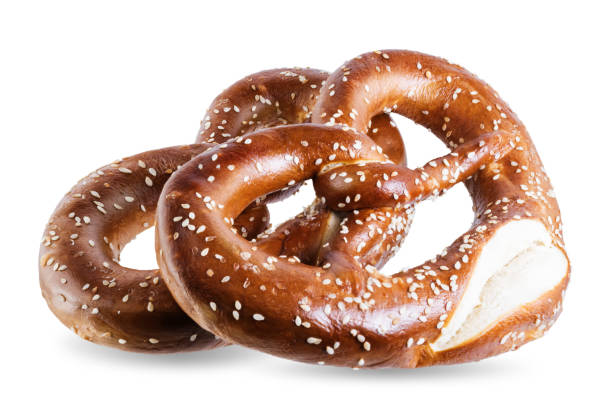 istock Pretzel with salt and sesame seeds on a white isolated background 1279213073