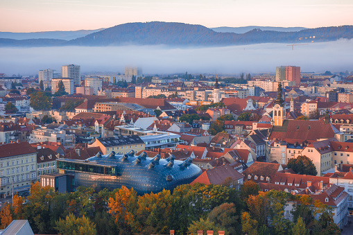 Cityscape of Graz from Shlossberg hill, Graz, Styria region, Austria, in autumn, at sunrise