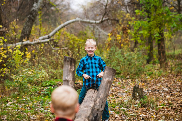 istock Happy boys play with wooden swing balancer 1279219007