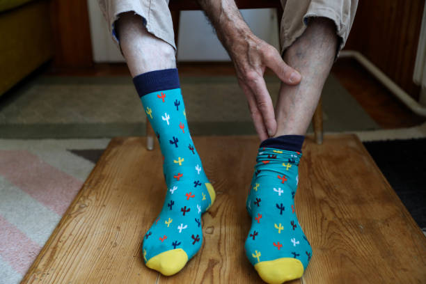 istock A hand to some action to put a sock on a foot 1279220483