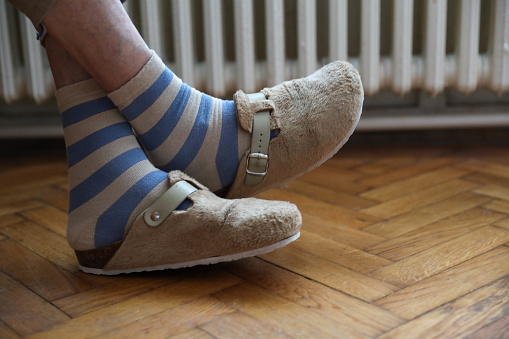 Wearing comfortable striped socks at home.