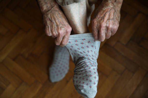 istock A hand to some action to put a sock on a foot 1279220566