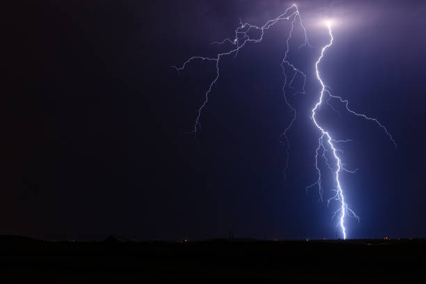 Thunderstorm lightning bolt strike stock photo