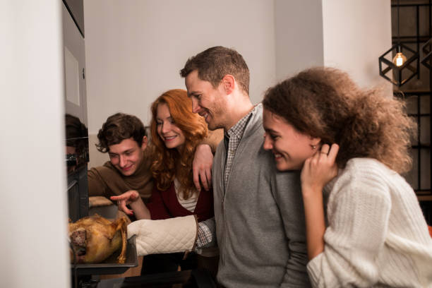 istock Kids baking a Thanksgiving turkey with their mom and dad 1279222471