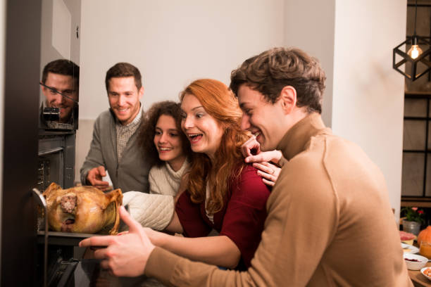 istock Family baking a Thanksgiving turkey and having fun 1279222472