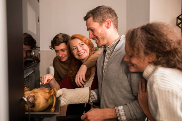 istock Parents and their kids baking a Thanksgiving turkey and having fun 1279222474