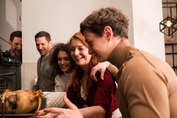 istock Family baking a Thanksgiving turkey 1279222478