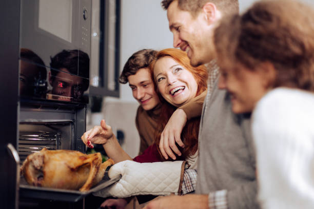istock Family having fun baking a Thanksgiving turkey together 1279222482