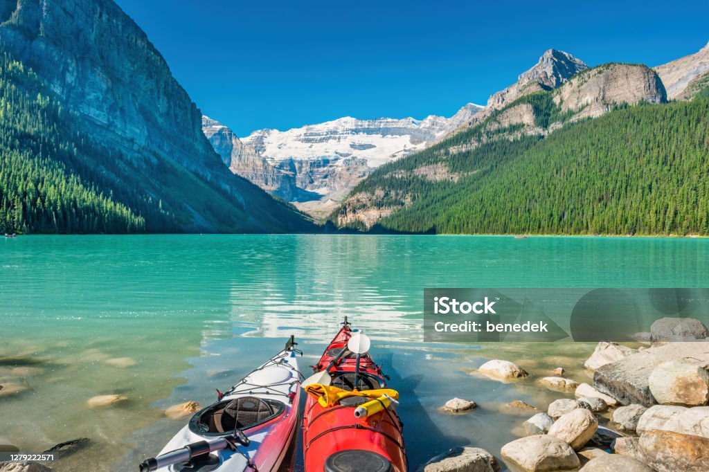 Kayaks at Lake Louise Banff National Park Alberta Canada Kayaks at Lake Louise in Banff National Park, Alberta Canada on a sunny morning. Banff National Park Stock Photo