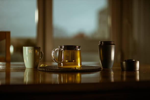 Teapot and cup on a wooden table