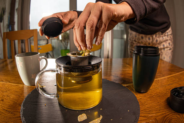 istock Tea ceremony. A young woman pours tea from a teapot 1279223782