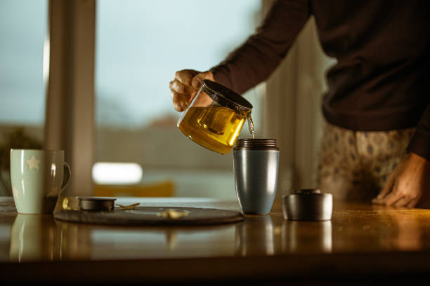 istock Tea ceremony. A young woman pours tea from a teapot 1279223788