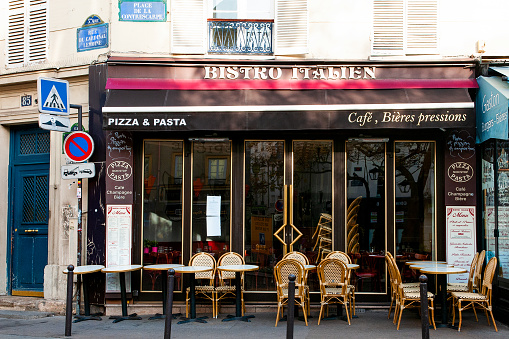 Charming parisian cafe terrace, outdoor tables, without people during pandemic Covid-19.  Paris in France . October 7, 2020