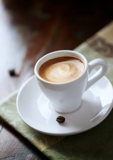 istock Cup of coffee on rustic wooden background. Close up. 1279227419