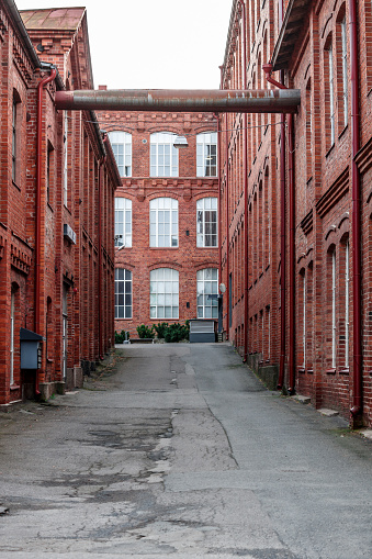 Narrow street in old industrial district - Forssa, Finland