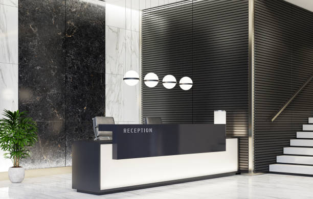 Modern Offices lobby interior area with elevators and stairs and with long reception desk Modern and luxurious Offices lobby interior area with elevators and stairs. Long reception desk.
Black marble wall tiles decoration. 3d rendering gold desk lamp stock pictures, royalty-free photos & images