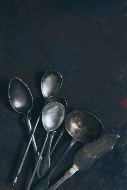 istock Silver set of vintage cutlery on a dark background, top view with a copy space 1279230430